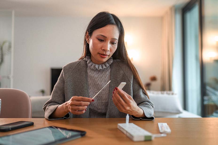 Woman getting at-home rapid COVID test