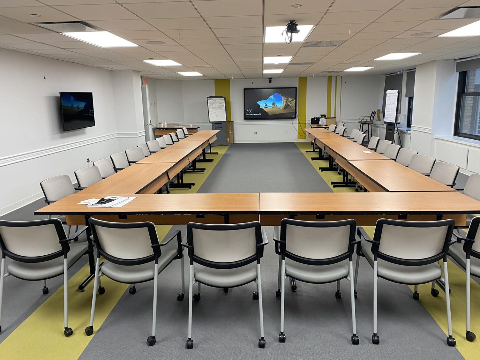 Yellow conference room in horseshoe setup